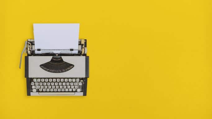 typewriter on yellow background