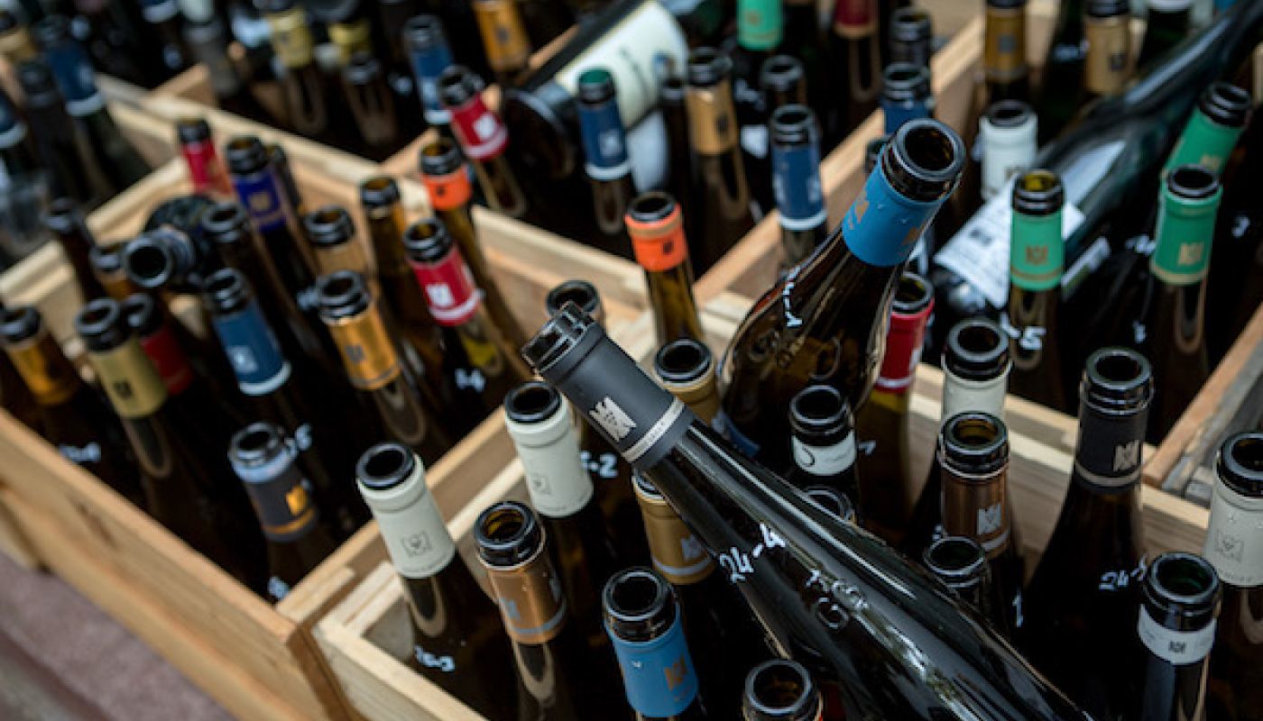 crates containing empty bottles of wine