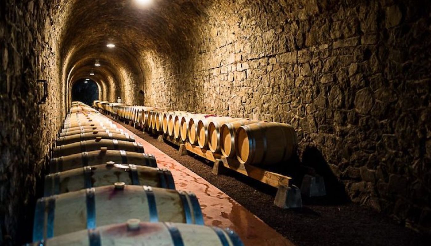 The barrel-filled tunnel of Domaine du Tunnel