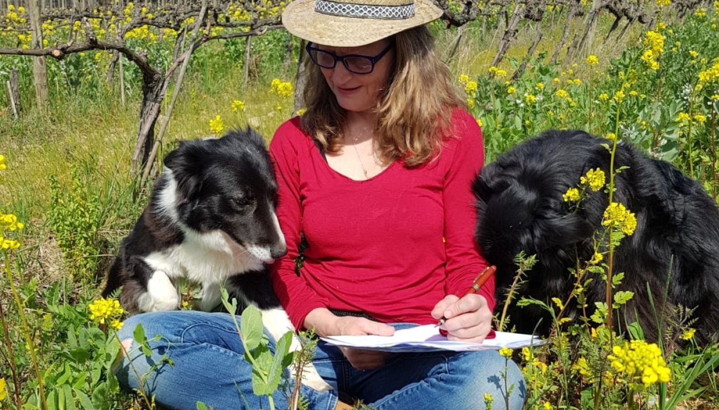 Katia Nussbaum and dogs in vineyard