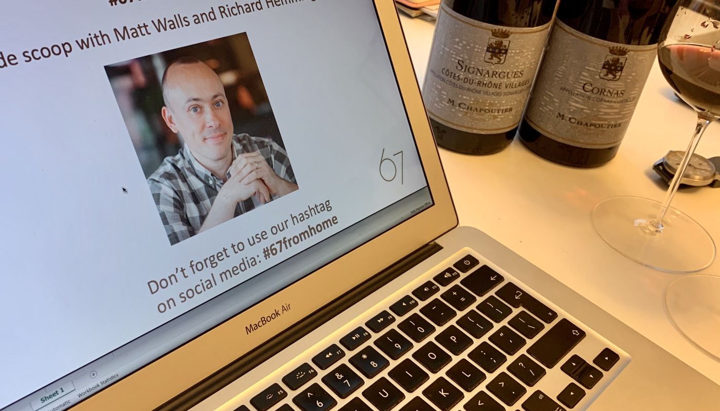 Laptop and wine bottles ready for an online wine tasting