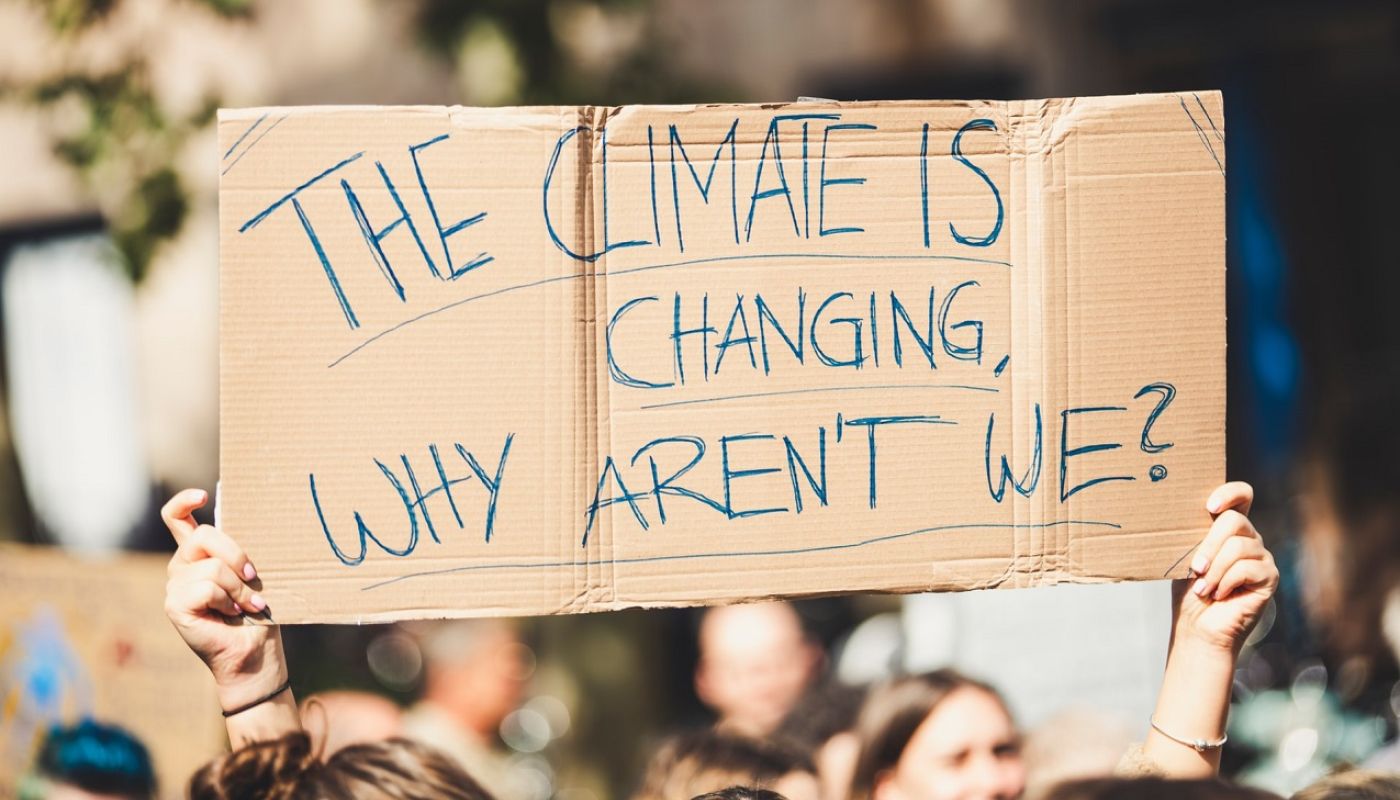 Protest placard - the climate is changing why aren't we?