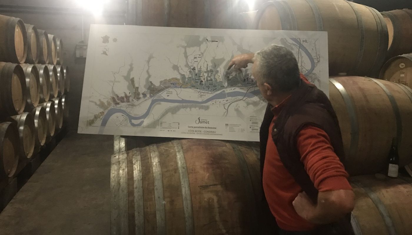 Jean-Luc Jamet in his cellar with a map of Côte Rôtie