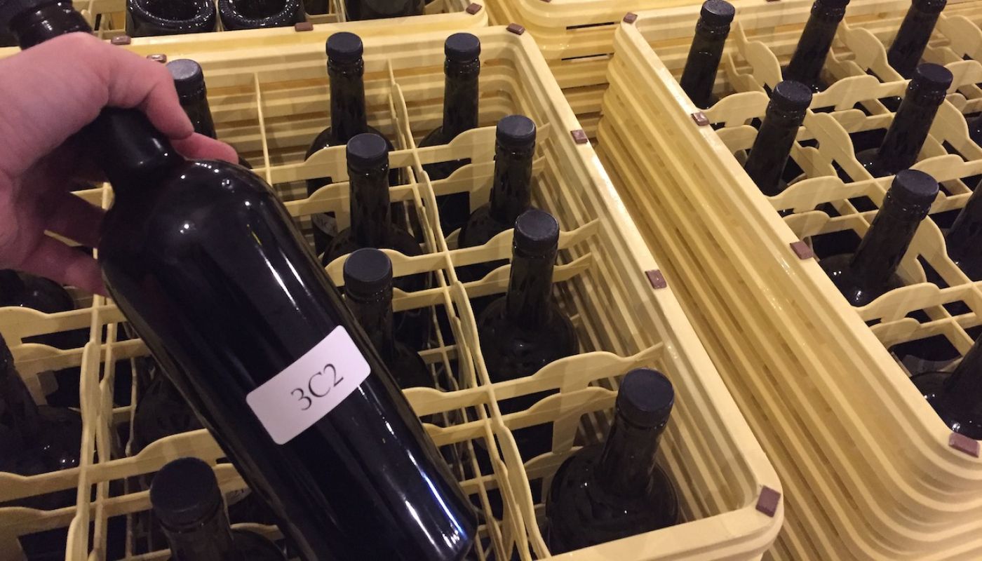 Crates of 2019 wine samples at Napa winery for bench tasting prior to blending