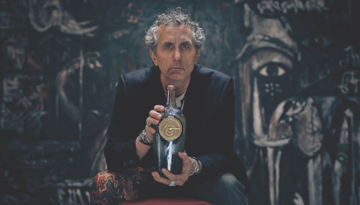 Winemaker and artist Lawrence Fairchild and a bottle of his Perrarus 2