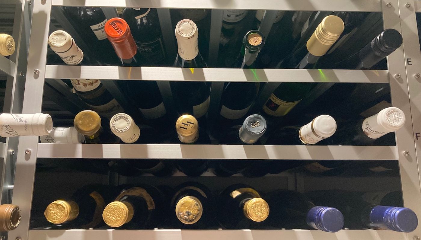 Bottles of Riesling maturing in a cellar