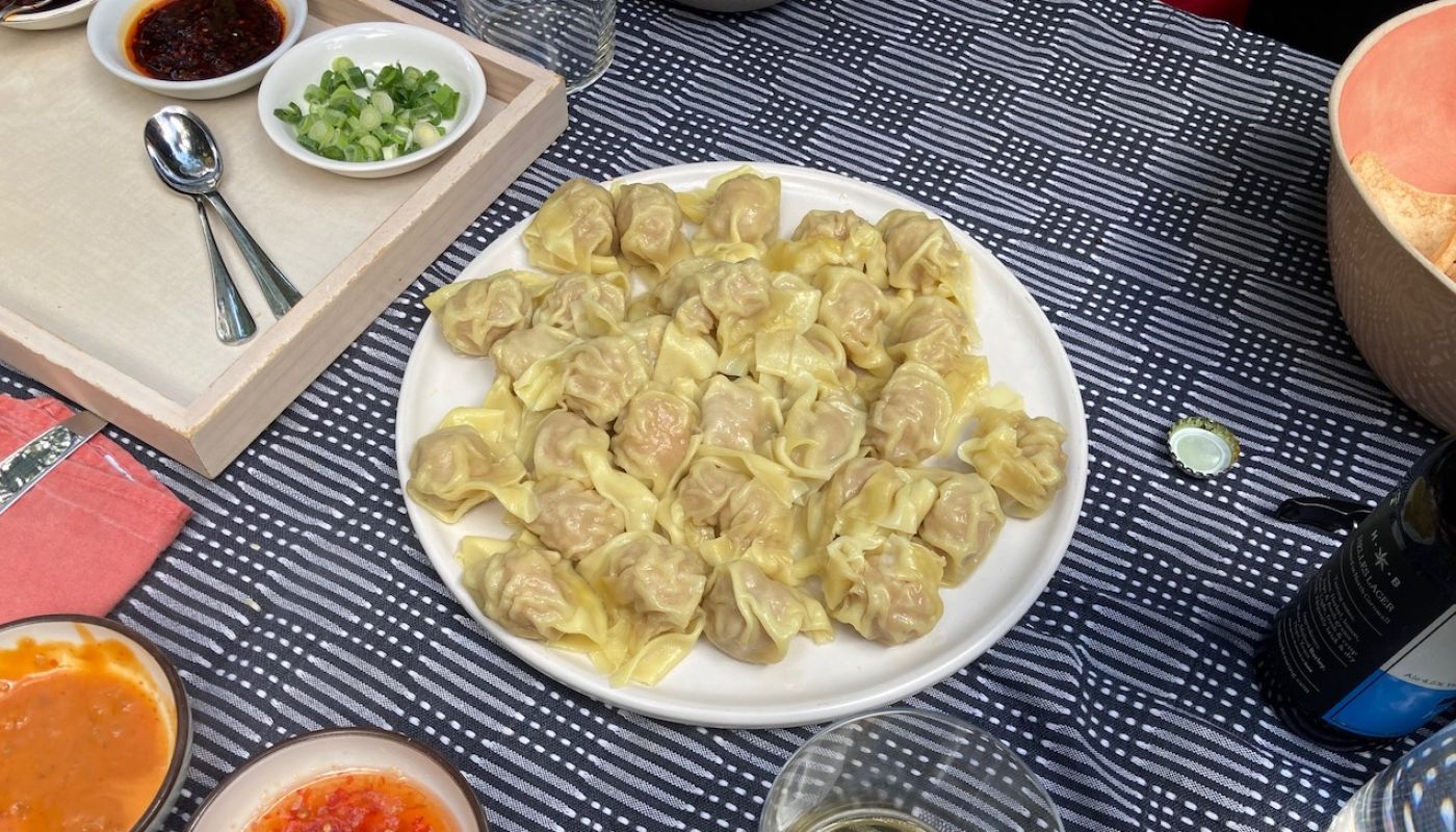 Wontons and sauces on a table