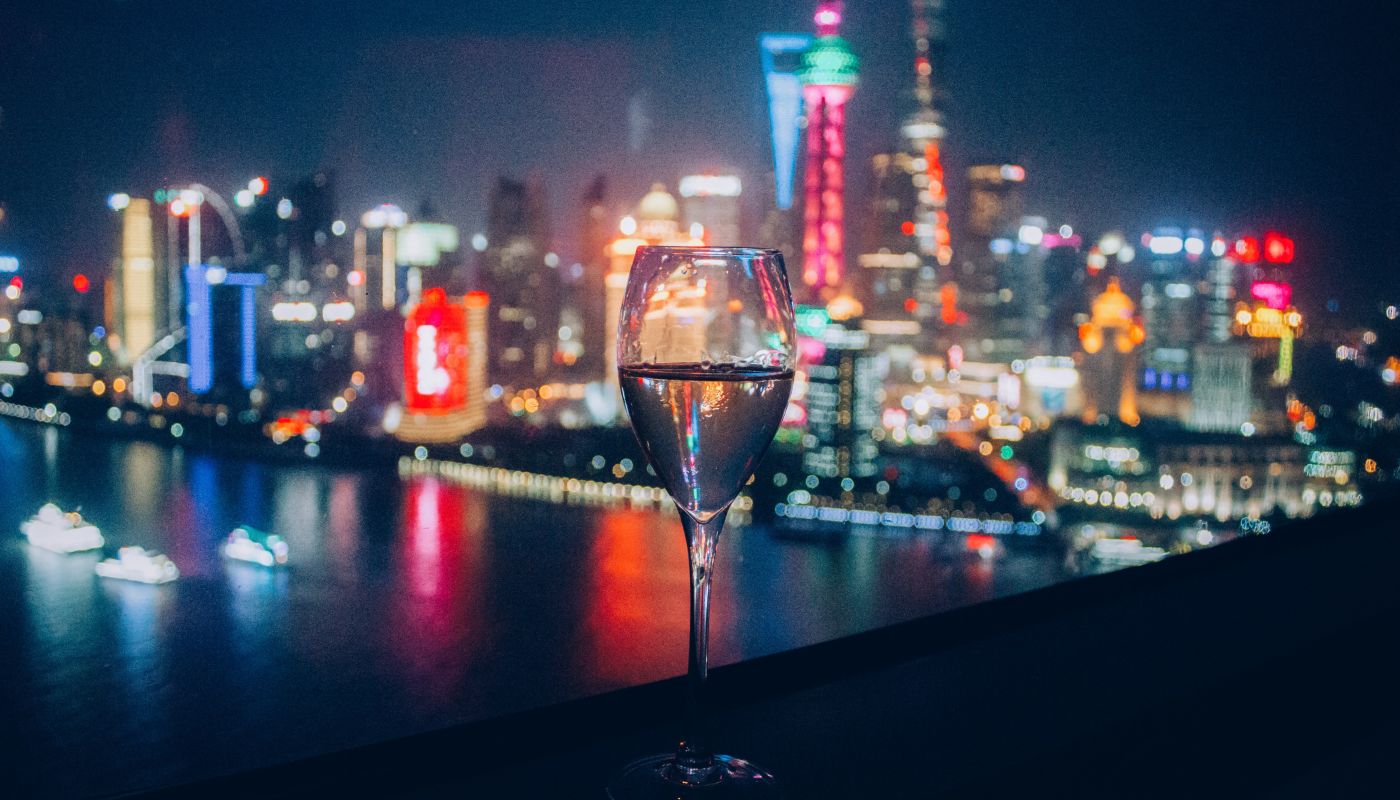 Glass of wine against Shanghai skyline