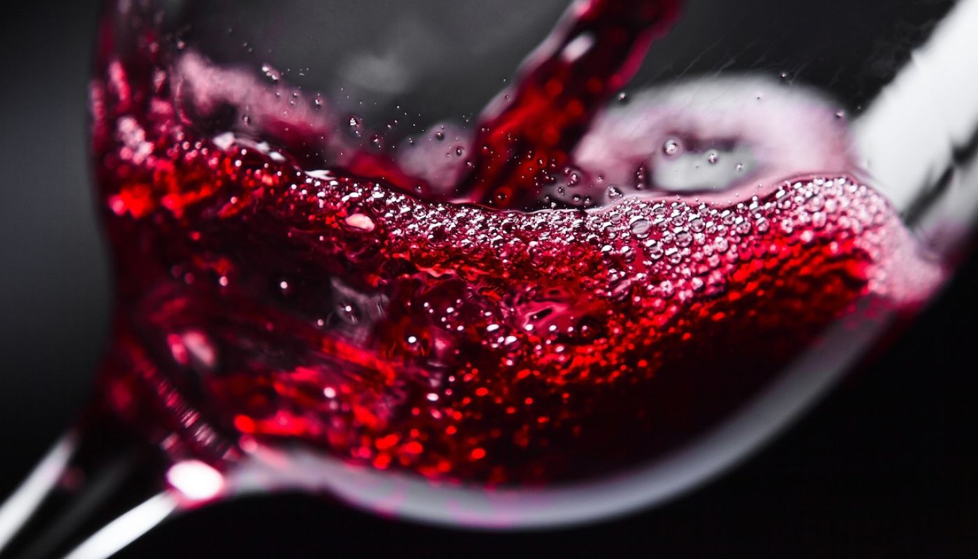 Generic red wine splashing into a glass