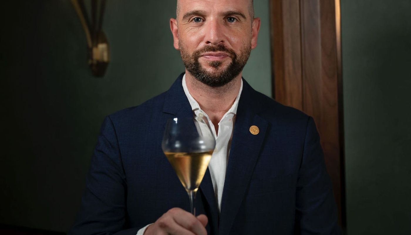 Richard Hemming with glass of champagne
