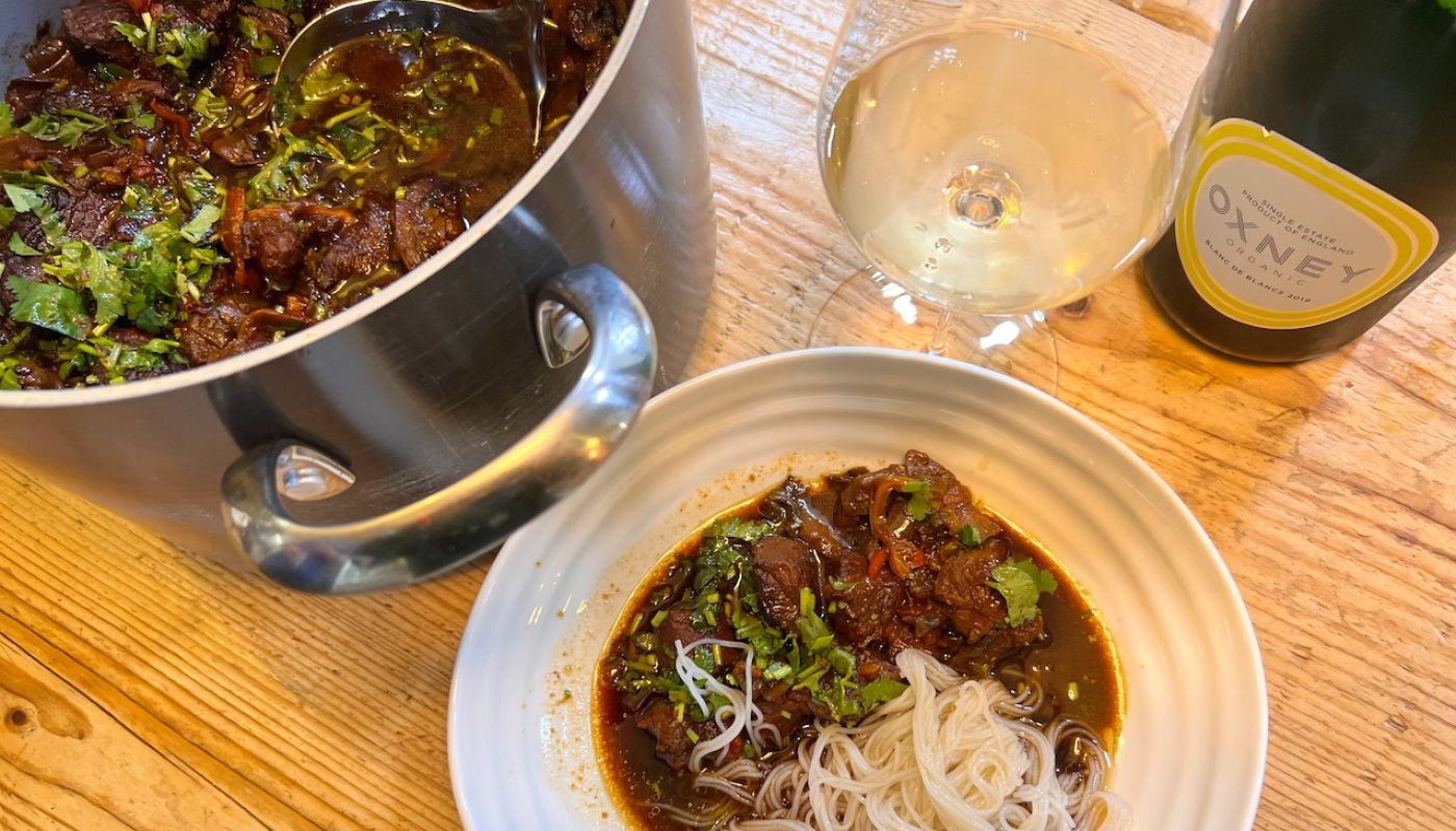 Oxney Blanc de Blancs with a pot and bowl of Thai beef stir fry