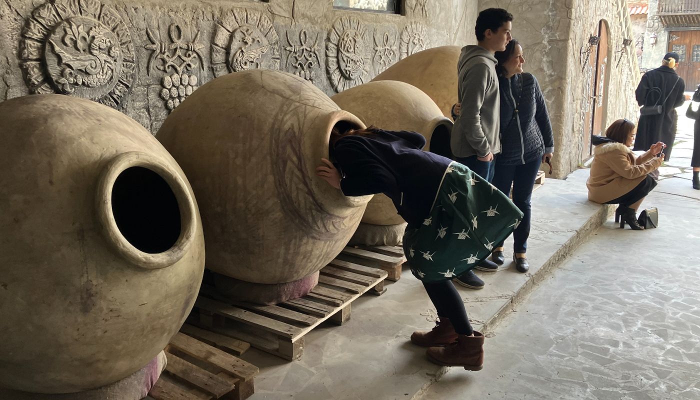 The author examining the inside of a karas at Voskevaz Winery, Armenia