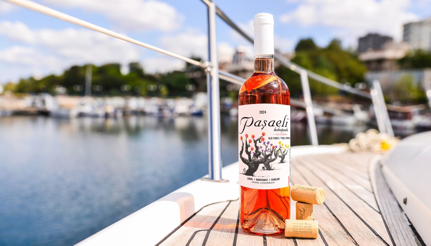 bottle of Pasaeli rosé on boat