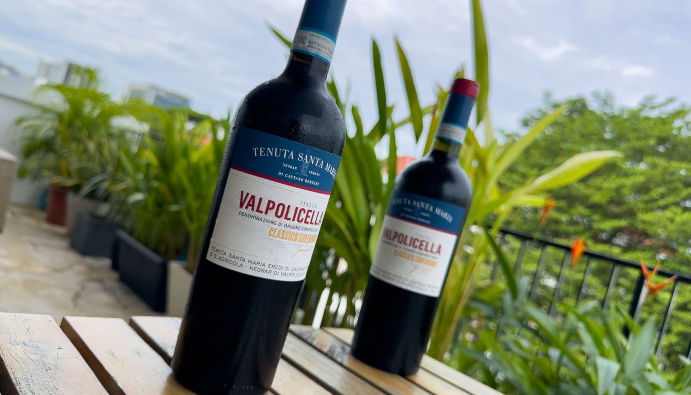 Two bottles of Santa Maria Valpolicella on an outside table