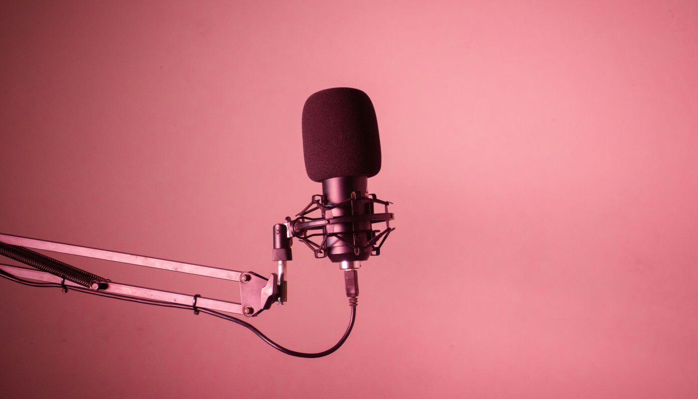 A microphone against a red background