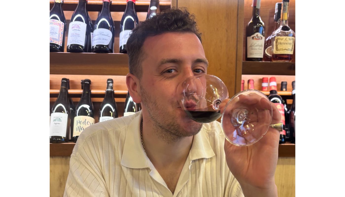 the author drinking said wine in Sicily