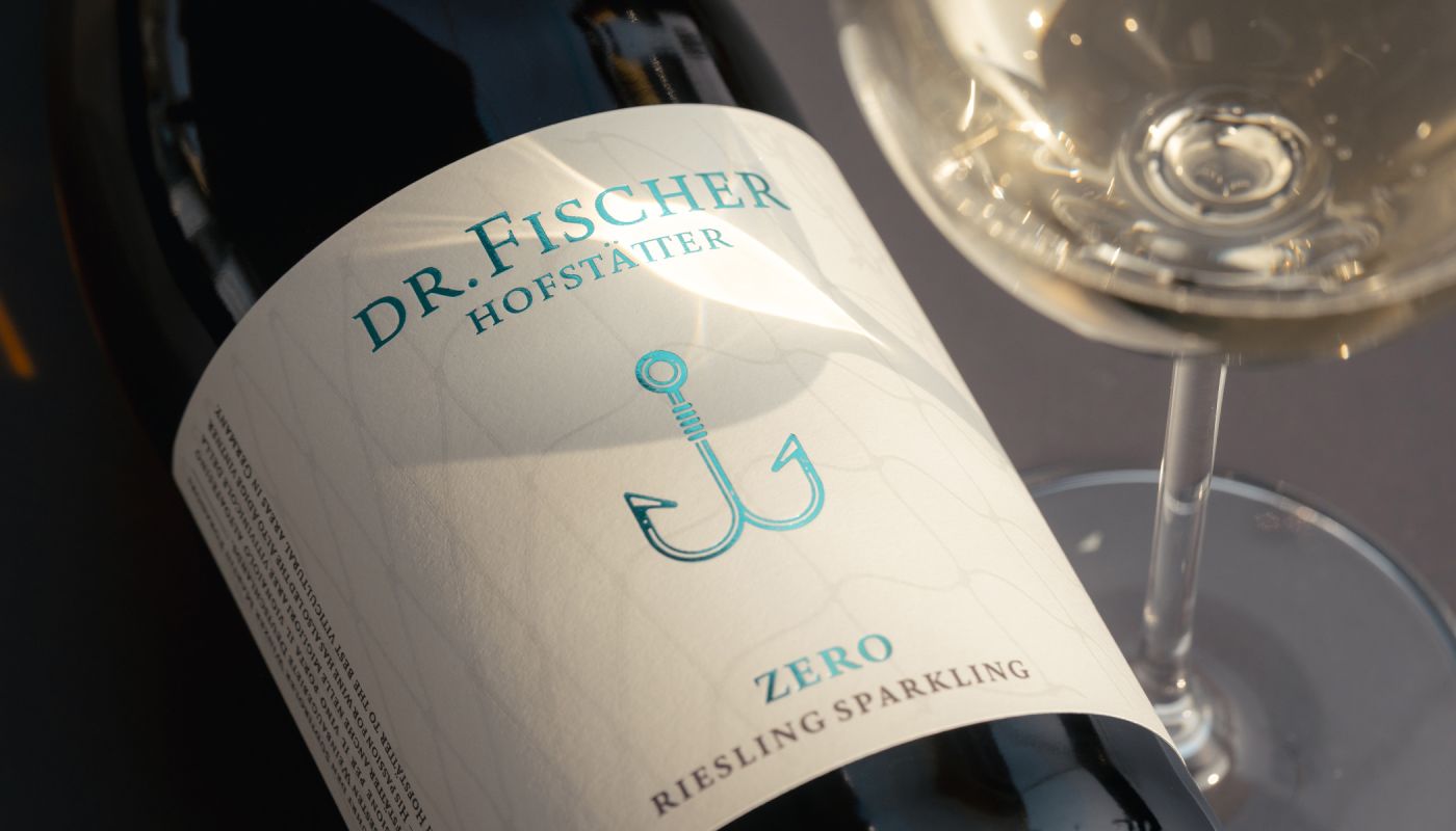 Weingut J. Hofstätter Dr Fischer Zero Brut Sparkling bottle with glass of white wine; Photo ©Mattia Mionetto