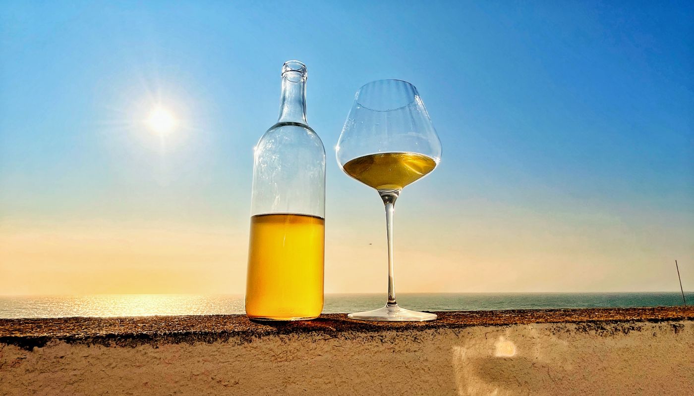 a bottle of wine by the sea