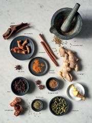 A collection of aromatic spices on a marble table