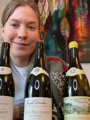 Samantha Cole-Johnson with 5 bottles of Burgundian Chardonnay