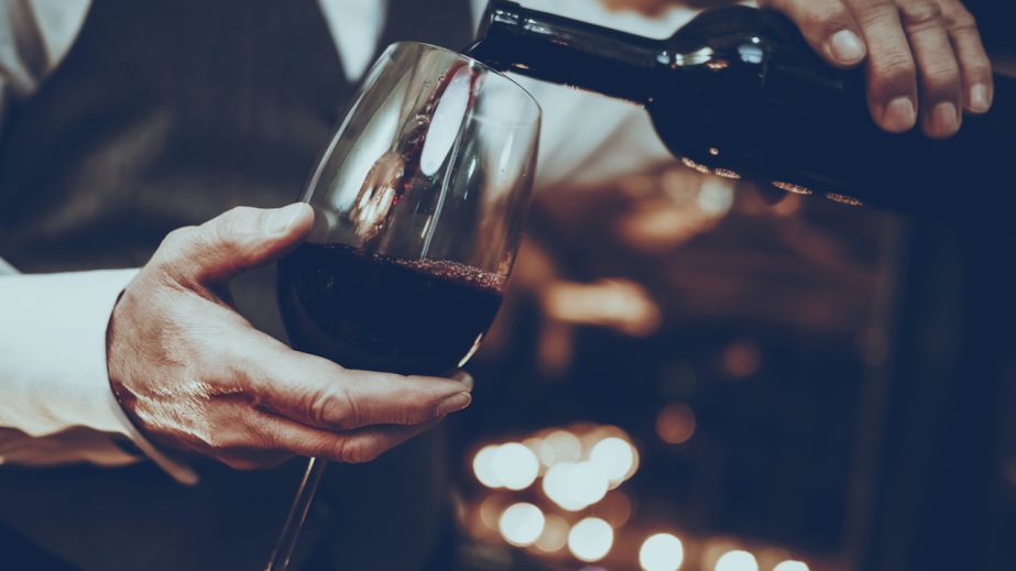 Wine waiter pouring