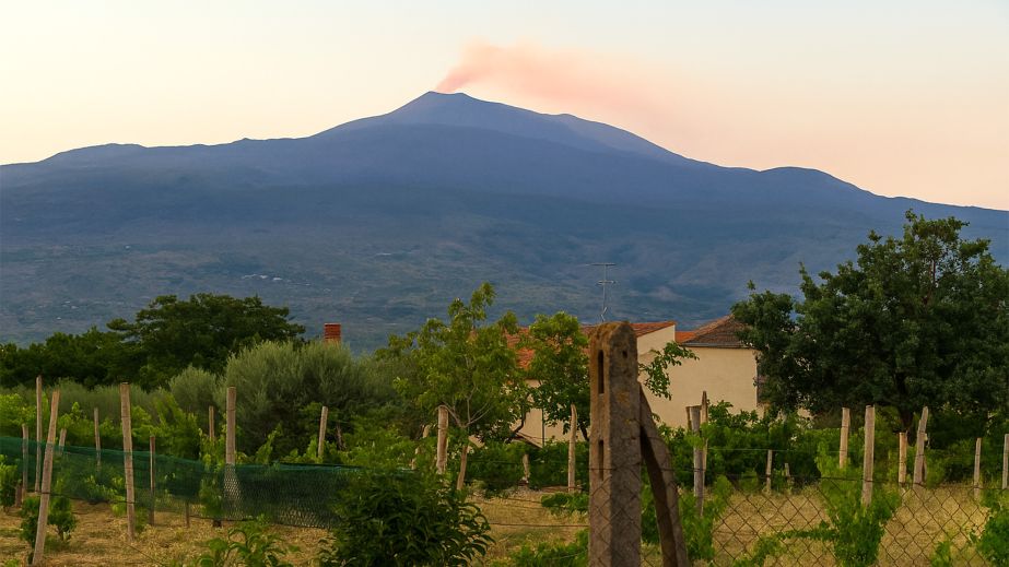 Etna volcano smoking against pink sky by Tone Veseth Furuholmen MW