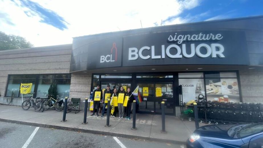 Employees on strike outside a BC liquor store