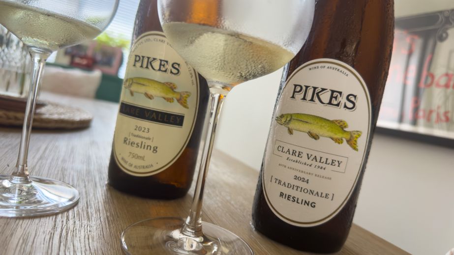 Two bottles of Pikes Riesling on a table with two partly filled wine glasses beside each bottle