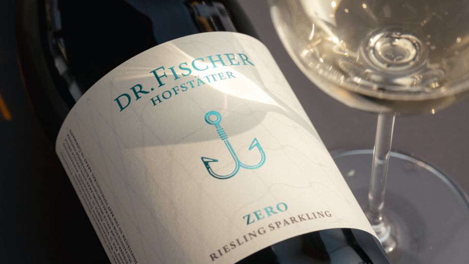 Weingut J. Hofstätter Dr Fischer Zero Brut Sparkling bottle with glass of white wine; Photo ©Mattia Mionetto