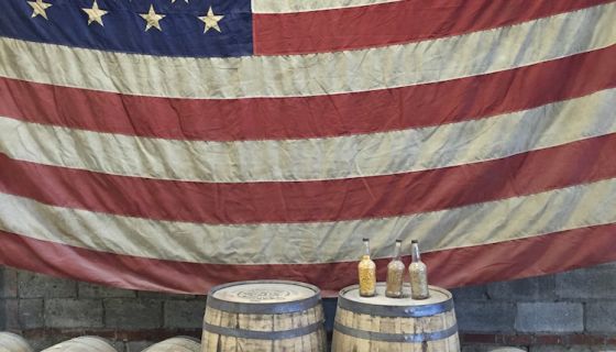 US flag and Tennessee whiskey barrels