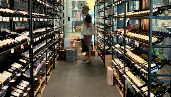 Richard Hemming choosing wine in Singapore