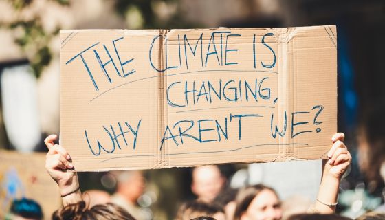 Protest placard - the climate is changing why aren't we?