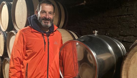 Jean-Marc Roulot in his Meursault cellar with a stainless steel barrel
