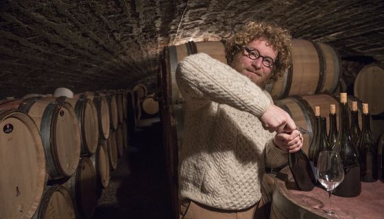 Sylvain Pataille opens bottles in his cellar