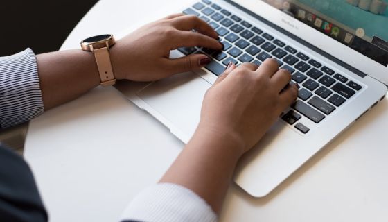 Hands on a computer keyboard
