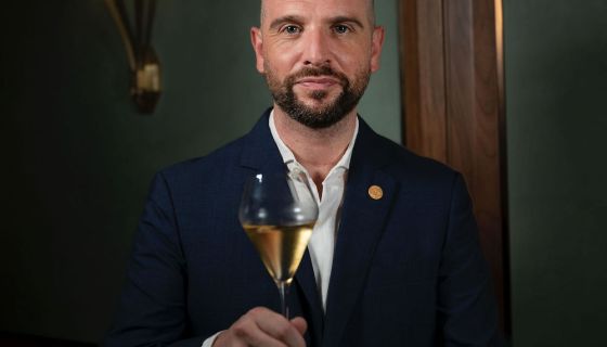 Richard Hemming with glass of champagne
