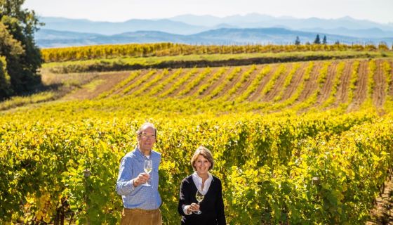 Jan and Caryl Panman in their Rives Blanques vineyards, the mountain behind them