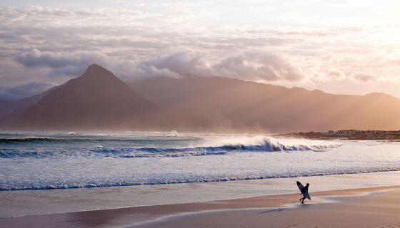 A surfer on the beach in South Africa