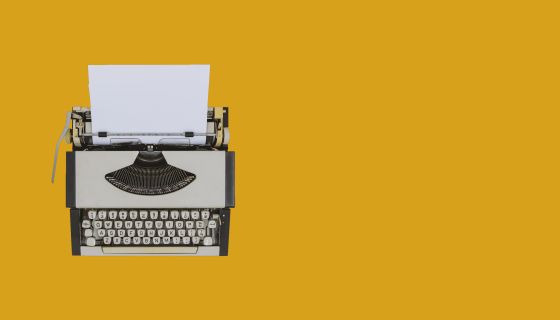 Typewriter on sienna background
