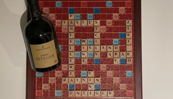 A bottle of Zibibbo with as Scrabble board in the background