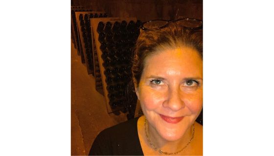 Caption: "Carol Kaufmann explores Champagne cellars in Epernay, France, believing that to know Chardonnay is to investigate it in all its expressions. “Someone has to do it,” she says."