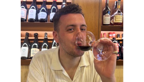 the author drinking said wine in Sicily