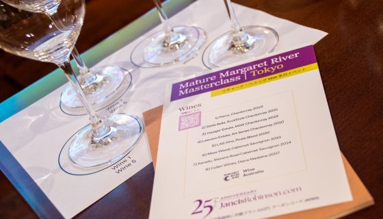 A flyer and four wine glasses