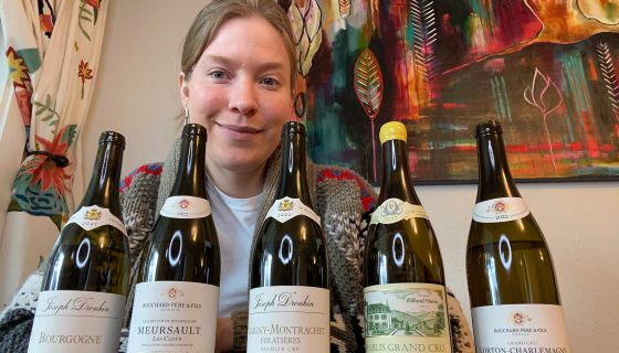 Samantha Cole-Johnson with 5 bottles of Burgundian Chardonnay