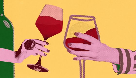 female urban hands each holding a glass of wine - Shutterstock