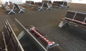 Empty airport with social distancing measures