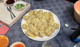 Wontons and sauces on a table