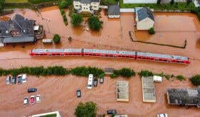 Floods in the Ahr Valley seen from above with submerged train and cars