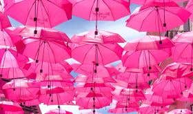 Pink umbrellas by chandler-walters-qFuKzUleXsw-unsplash