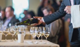 pouring wine at the Oregon Chardonnay Celebration 2022 photo credit Josh Chang